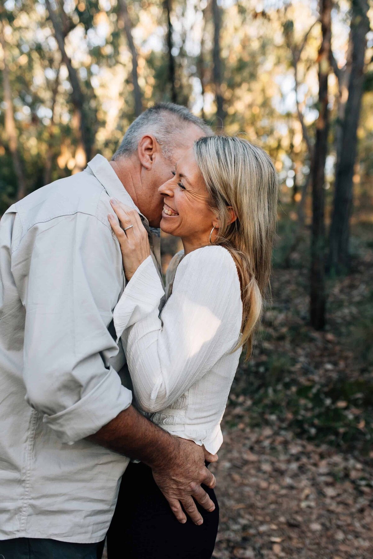 Older couple embracing in bushland couple photography Melbourne