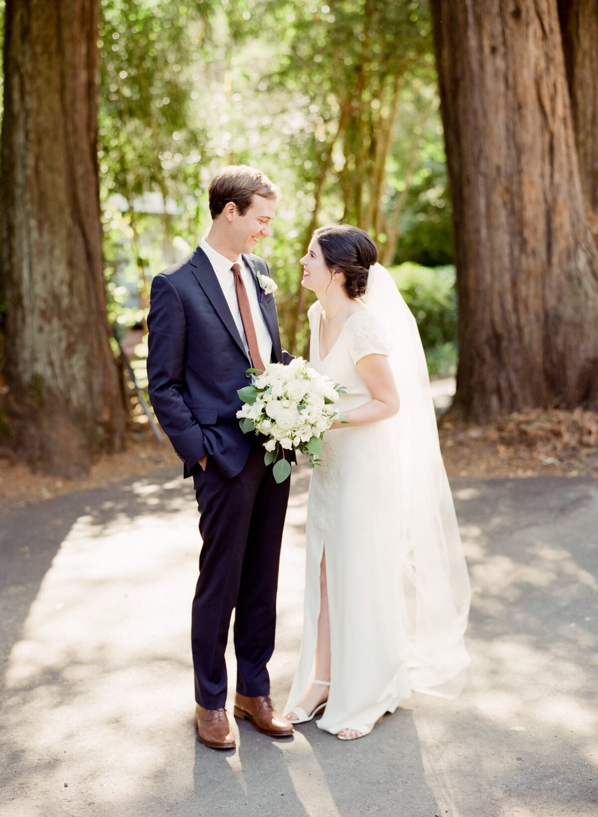 Beautiful couple look into each others' eyes at a memorable forest wedding in Washington.