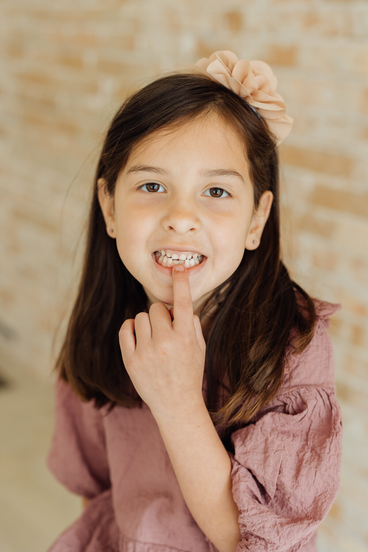 child smiles with missing tooth at utah county family photography session