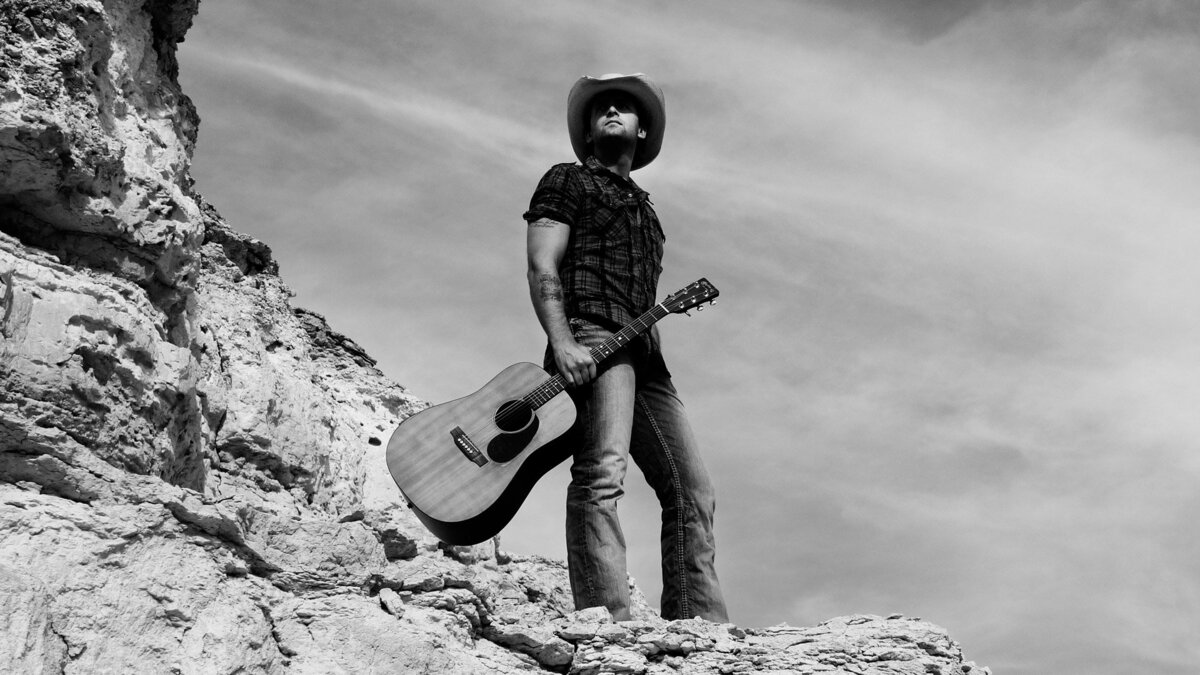 Country Music Artist Dean Brody with guitar Shoshone Nevada black and white long shot holding guitar