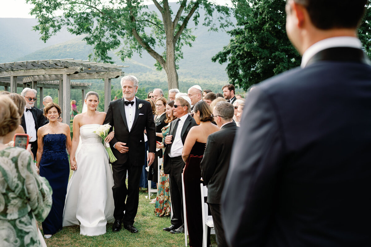 groom looks at bride at hildene wedding in manchster, vt ceremony