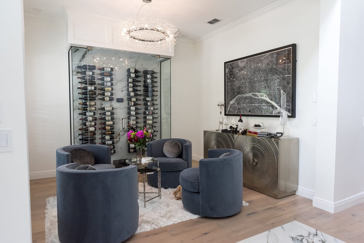 dewine design orlando interior designer modern lakehouse glass wine display with blue chairs