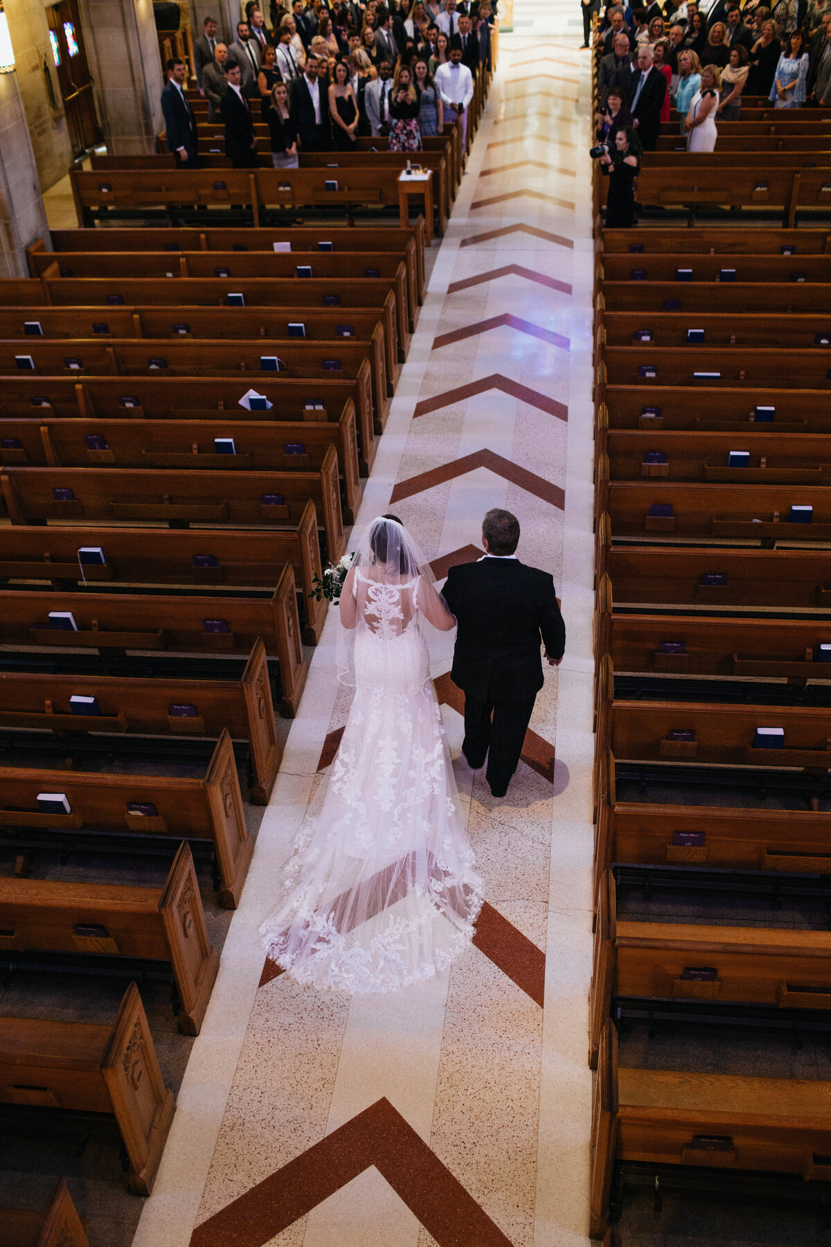 Bride-walking-down-the-aisle-at-church-ceremony-Christina-Kelly-Photography
