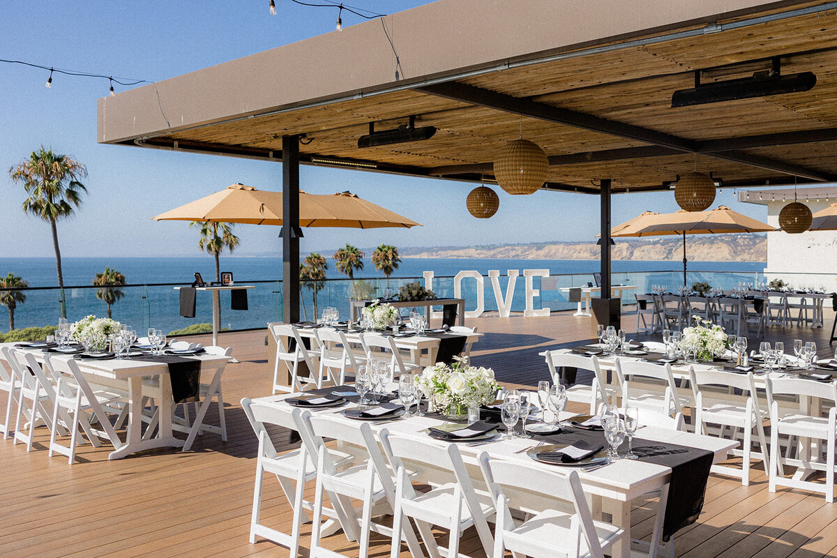 Wedding table scapes at San Diego Wedding with palm trees and ocean in the background