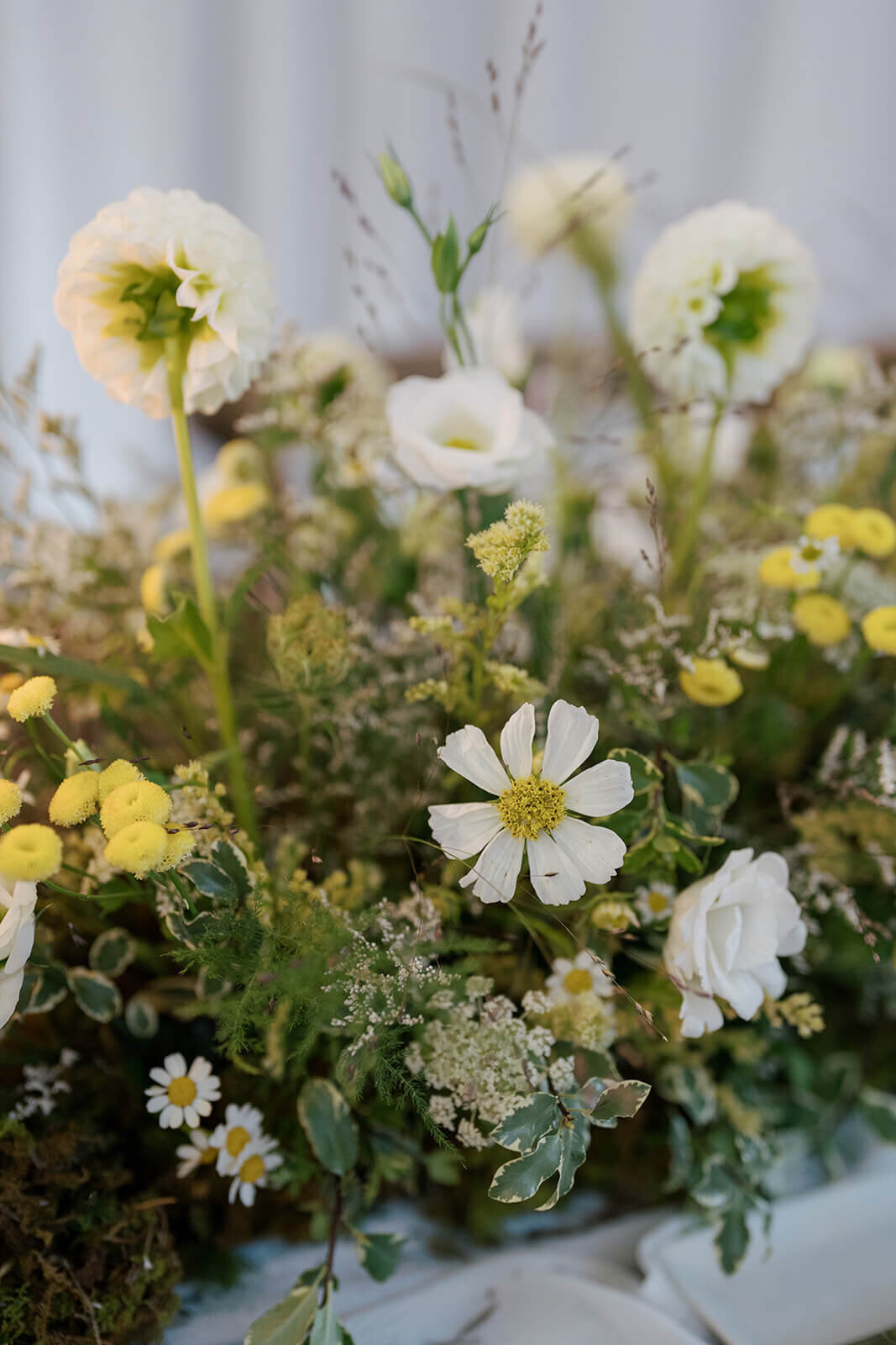Close up image of the beautifully elegant tabletop floral design at the Aspen Meadows Resort wedding reception.