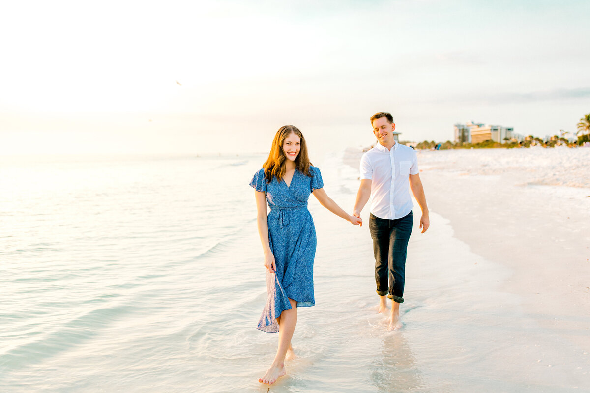 engaged couple for photos at lido key beach in florida