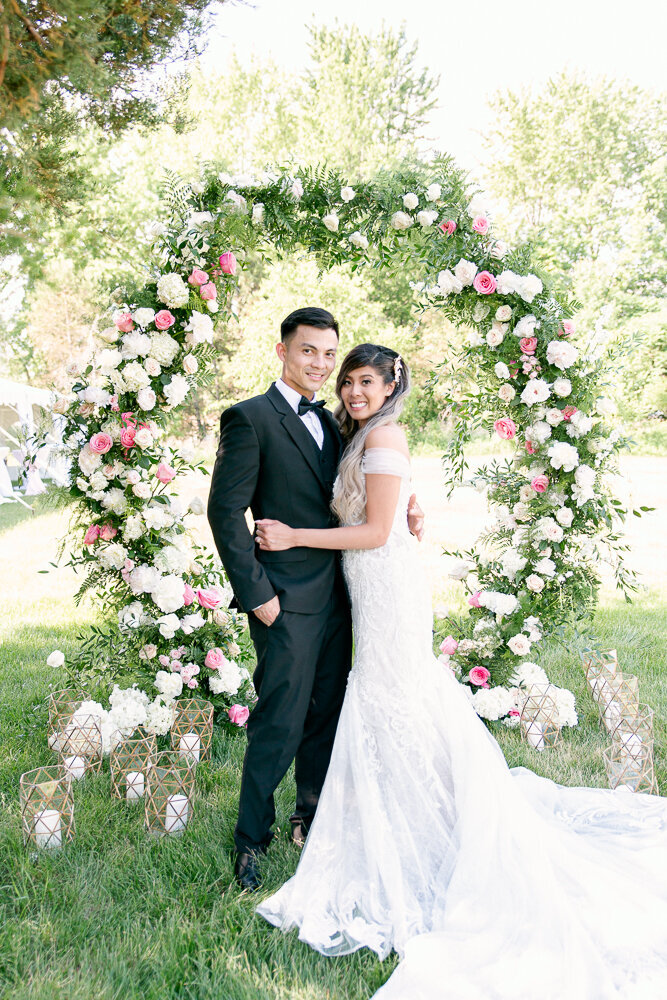 flower arch bride and groom