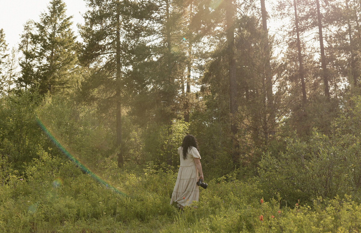Blurry photo of Brigette walking away with her camera in hand