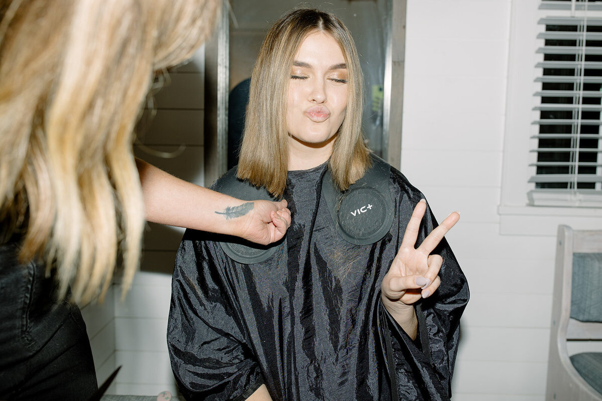 Bride getting a pre reception hair cut