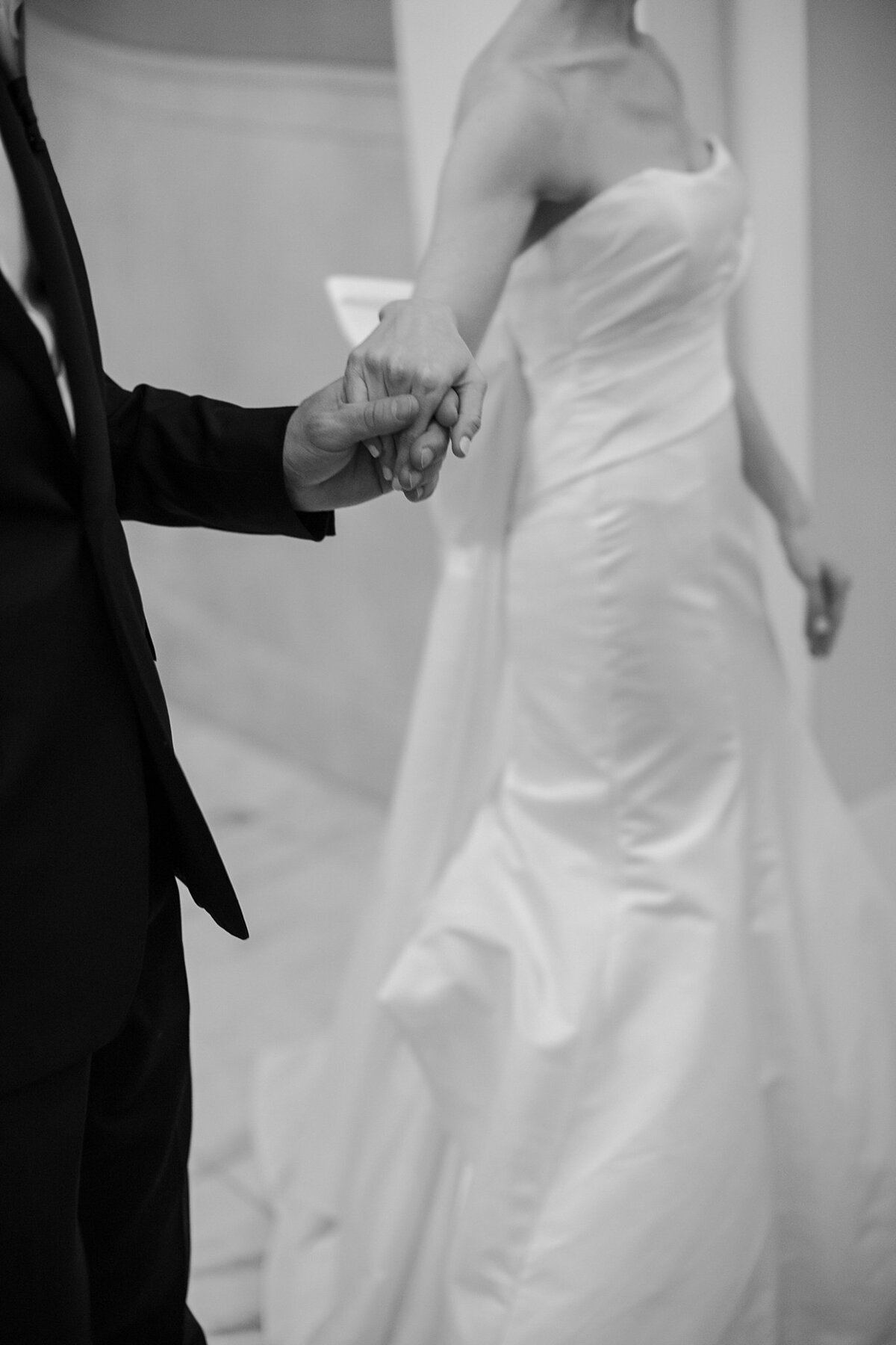 Bride and Groom walk hand in hand through the lobby of Fairmont Copley during their wedding. Deborah Zoe Photography.