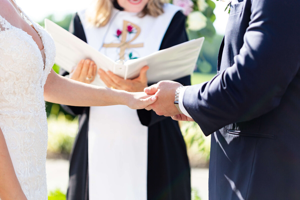 bride and groom exchanging vows at Stones River Country Club