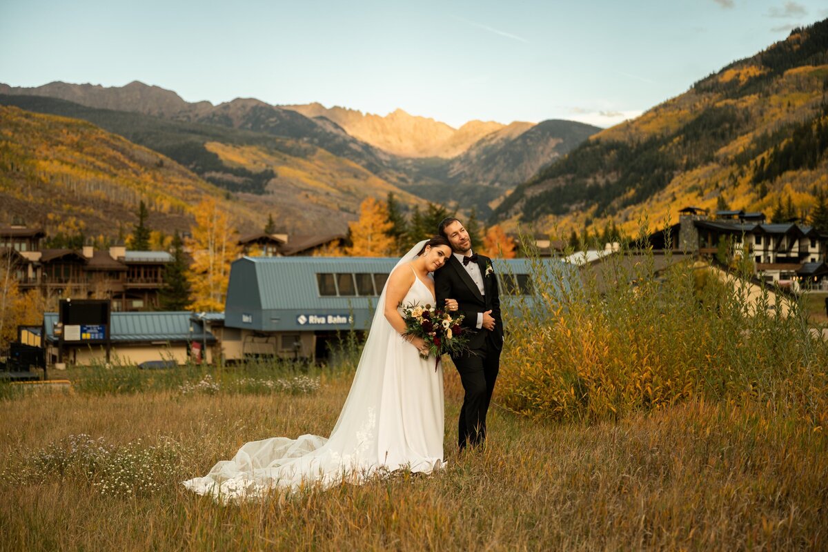 Bride and groom pose in Vail, Colorado.