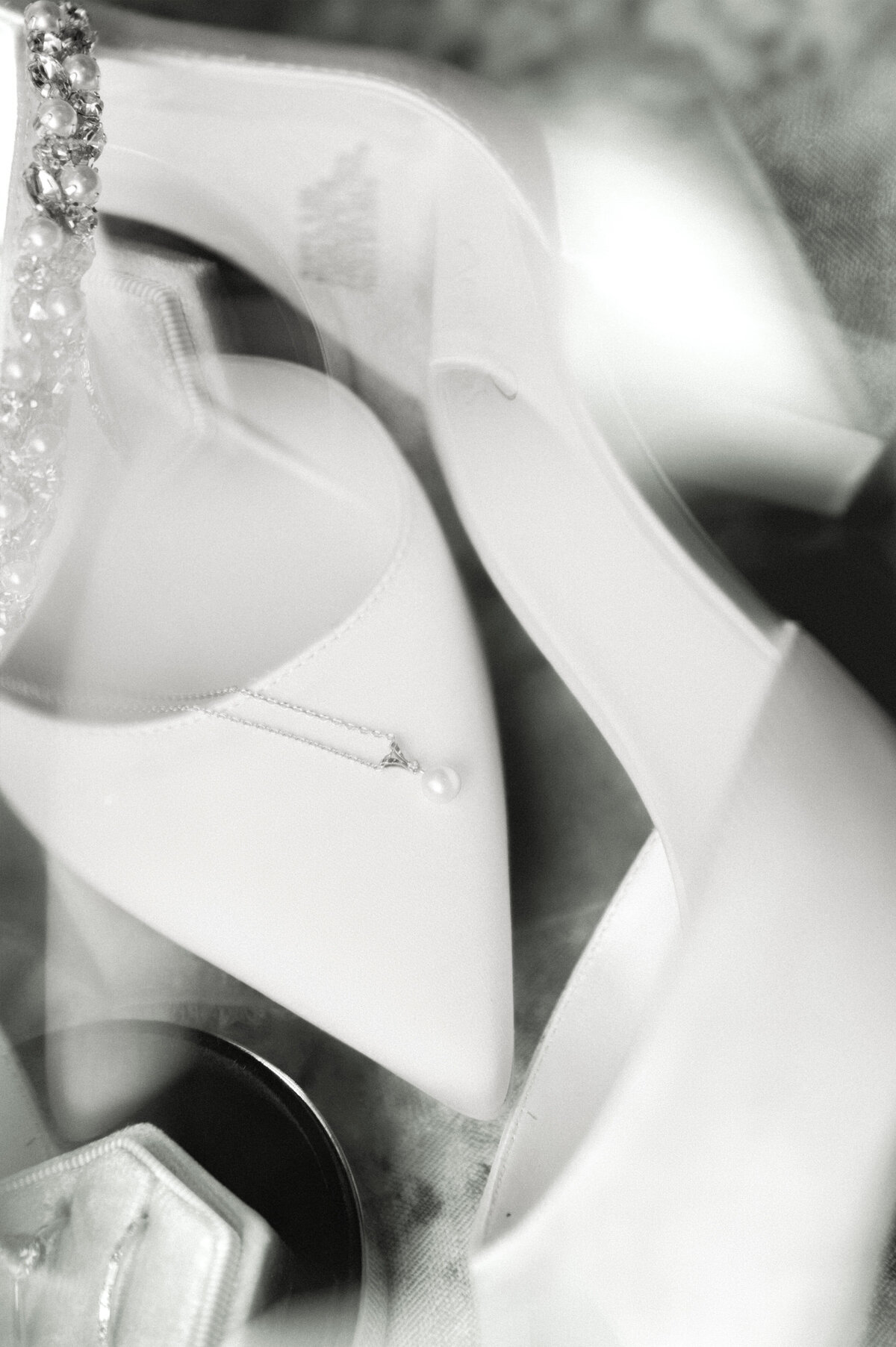 black and white modern wedding photos 2025 of bridal details, shoes, jewelry, rings by austin wedding photographer