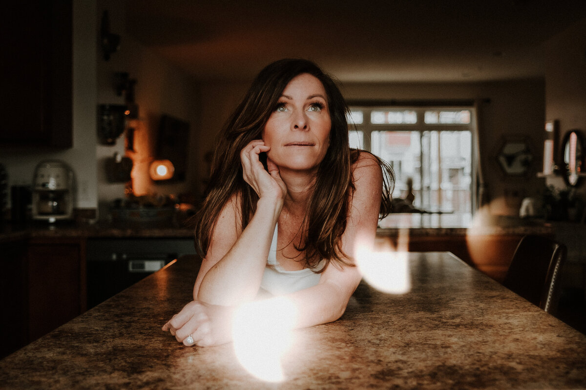 A senior girl and her mom share a joyful moment during a laid-back photo session in Minneapolis, reflecting the warm and personalized experience families have with Shannon Kathleen Photography.