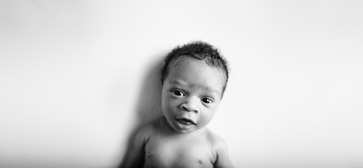 boy smiles at camera at studio in tampa, fl