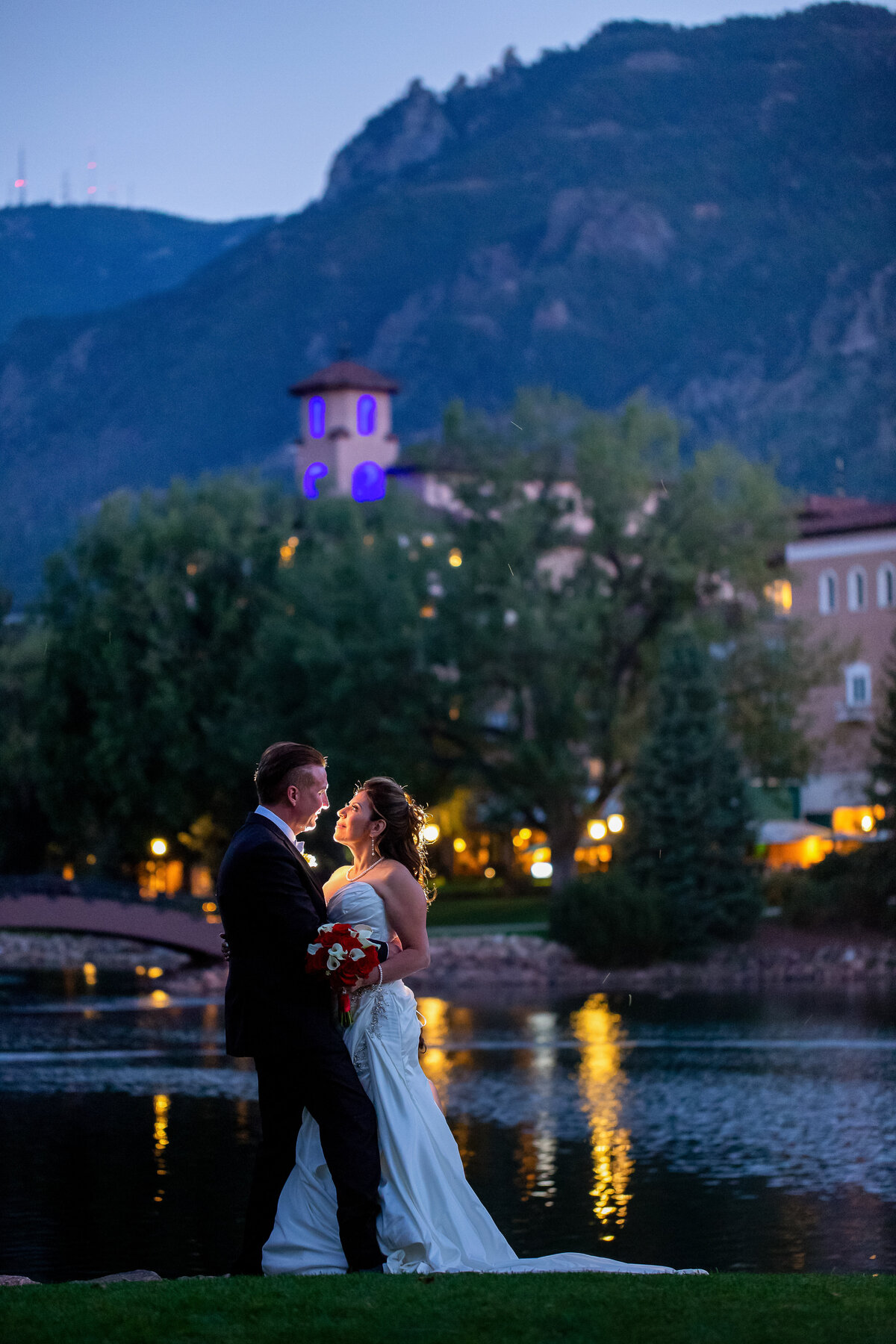 A Newly Married Couple Pose at Dusk at the Broadmoor