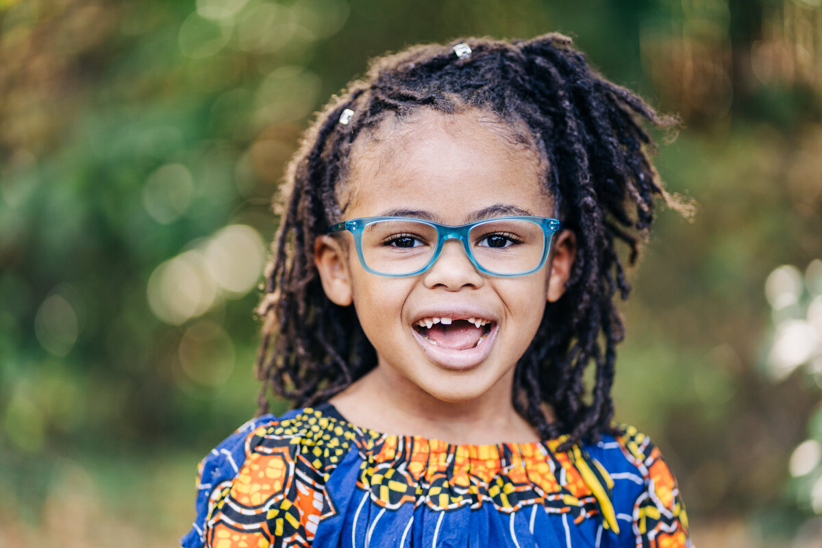 girl-with-glasses-bright-dress