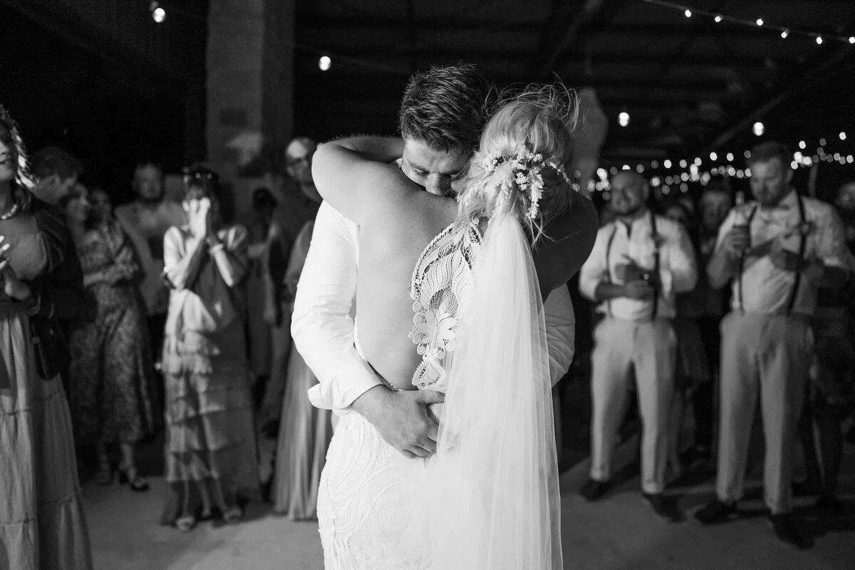 Lisa Watson Photography_Mandurah and Perth Wedding Photographer couples embrace during fun reception at Perth beach wedding