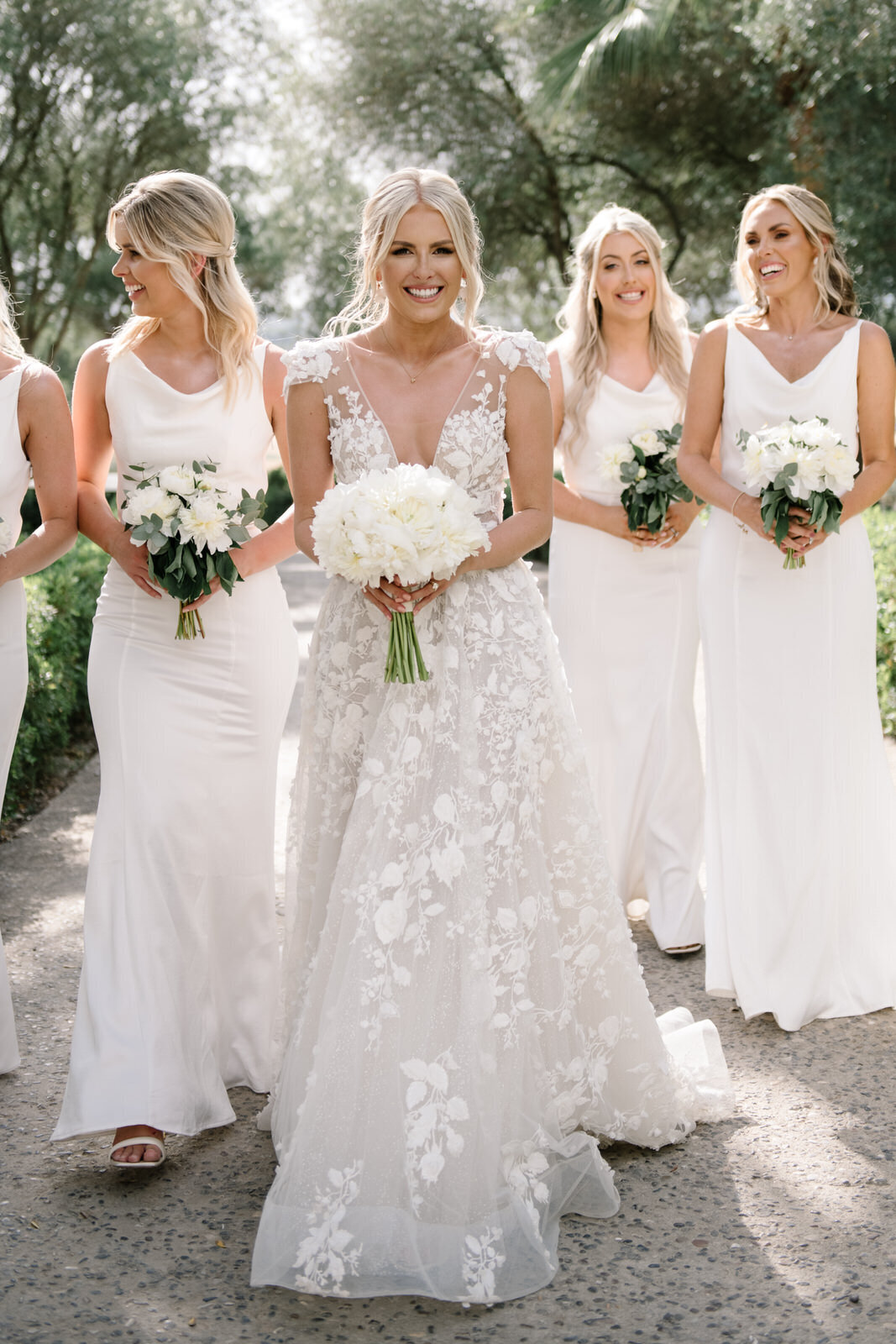 bride and bridesmaids in all white