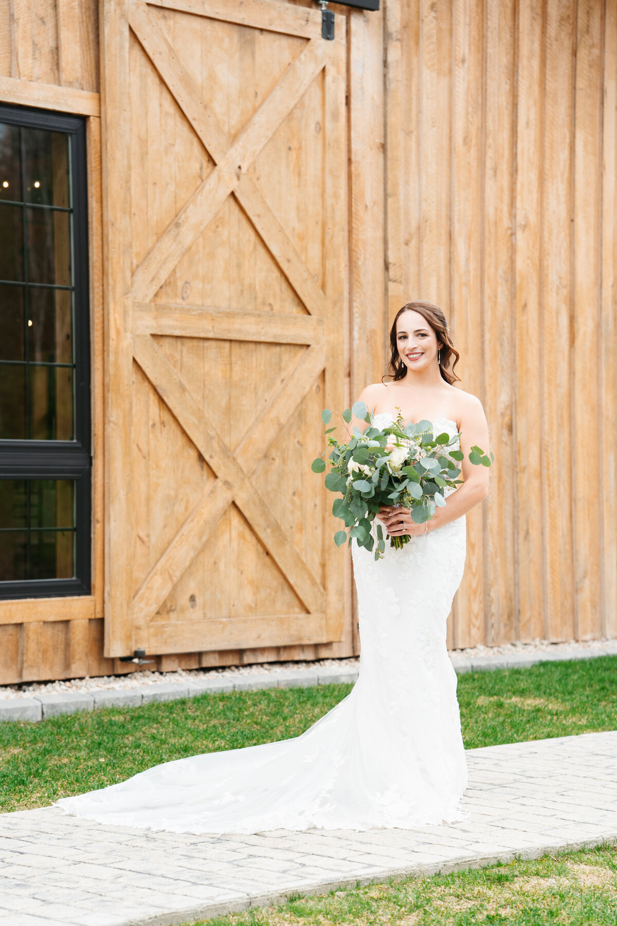 Bride and groom walking hand in hand at their outdoor New England wedding
