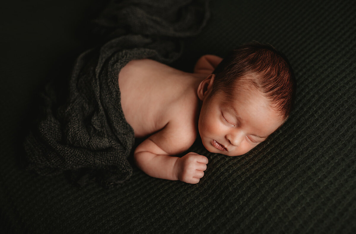 Ellicott City Newborn Photography Baby on Green Backdrop