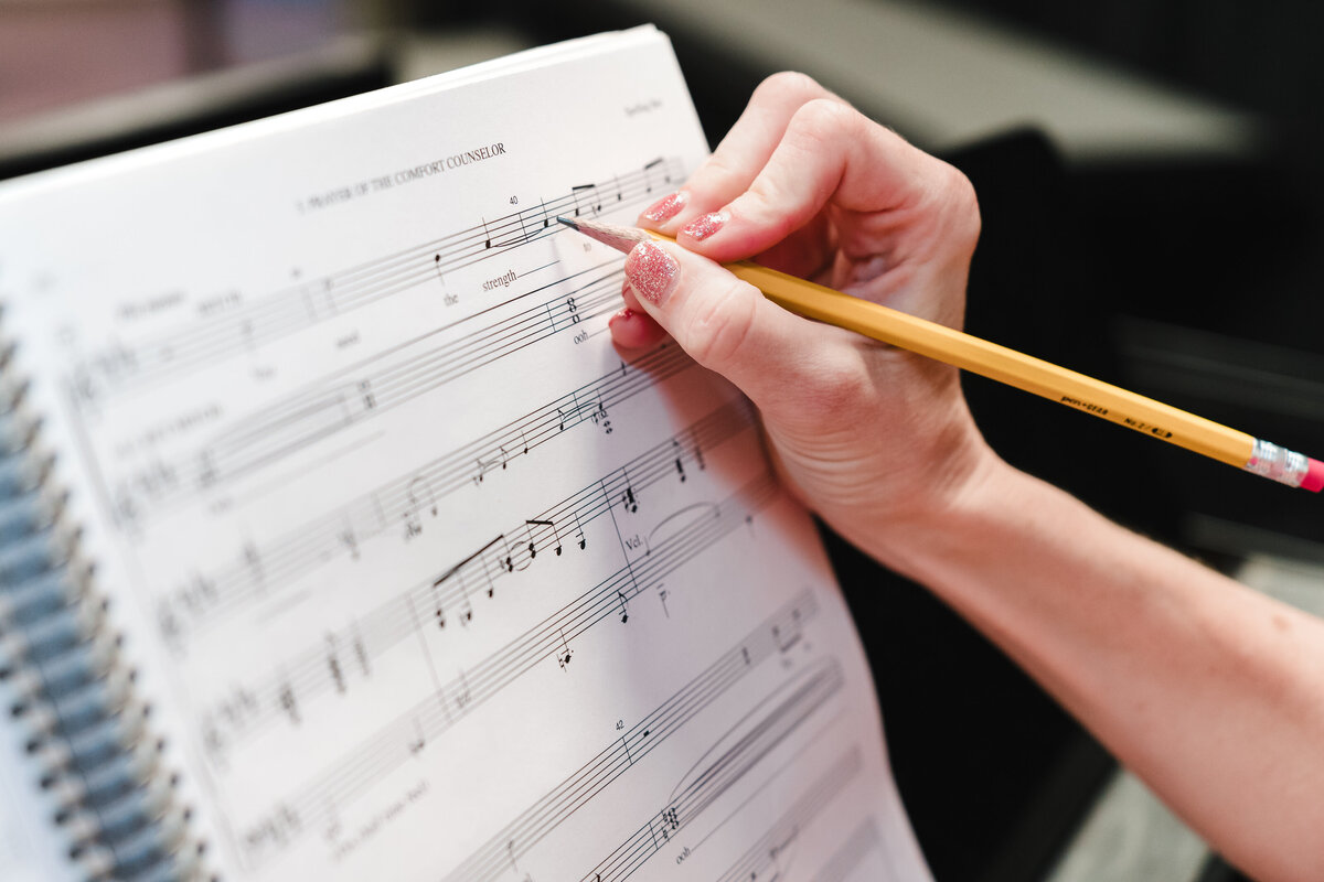 hands of a pianist on the score