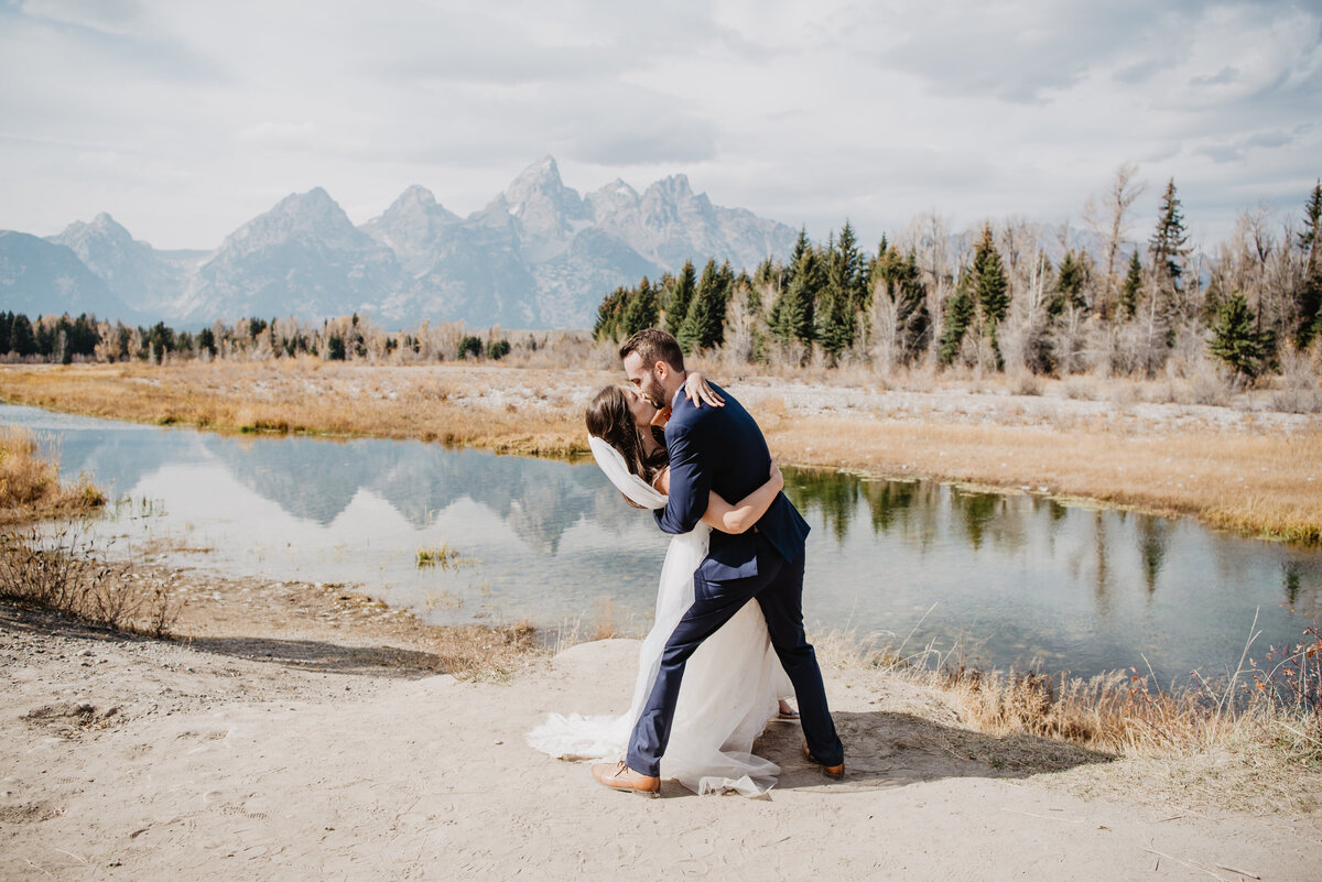 Photographers Jackson Hole capture groom dip kissing bride