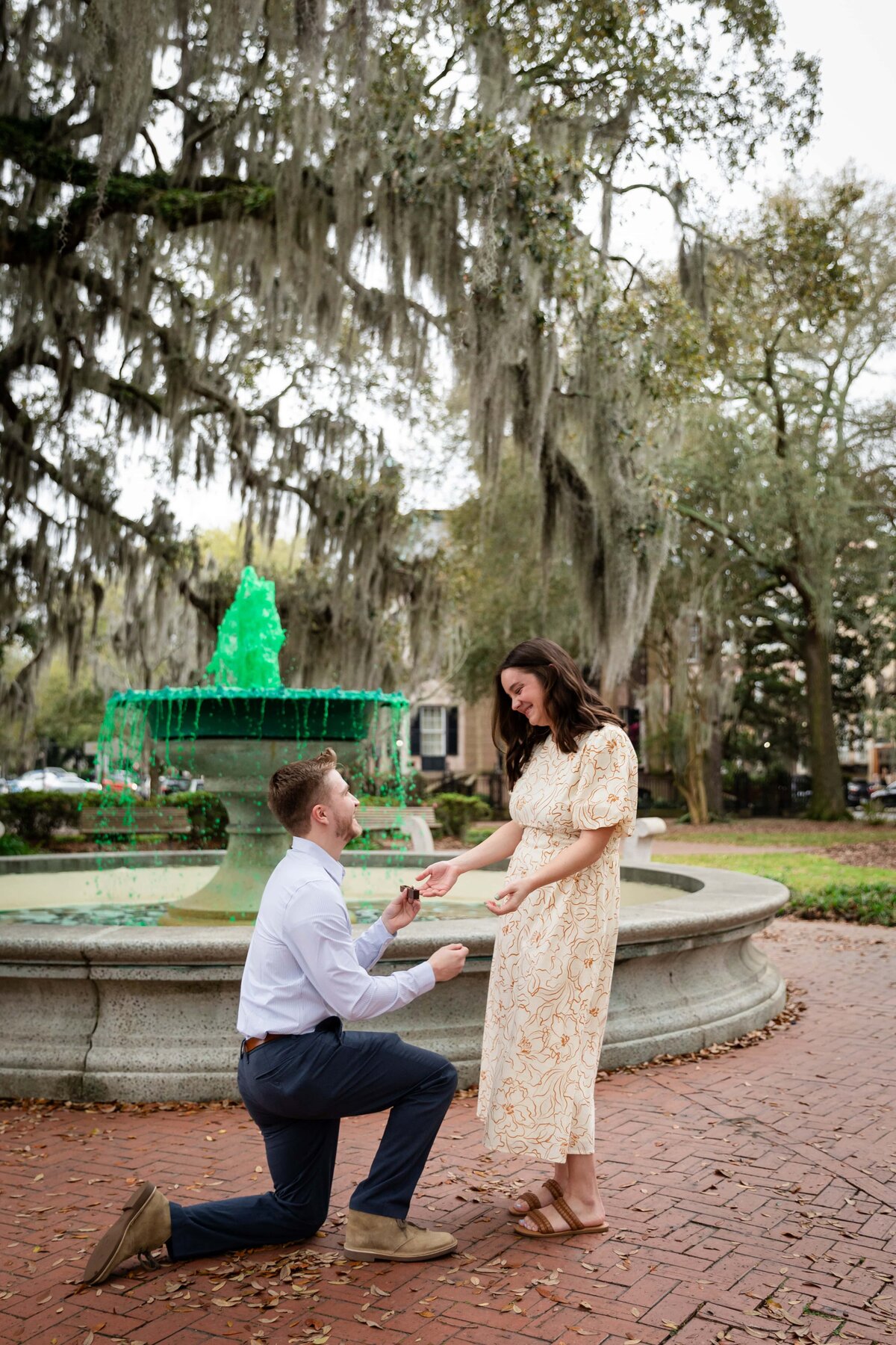 Proposing in front of Orleans Square, Savannah | Photo by Phavy Photography, Savannah Proposal Photographer