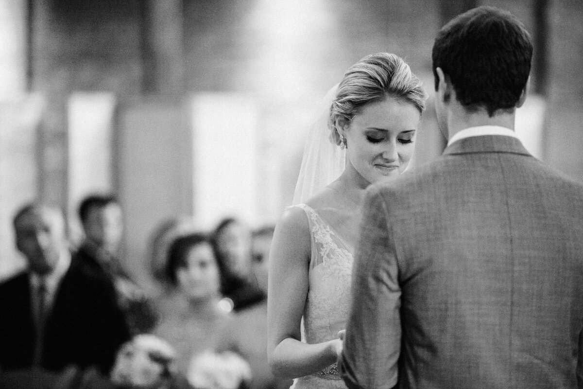 A black and white photo of a wedding ceremony taking place at Gallery 1028 in Chicago