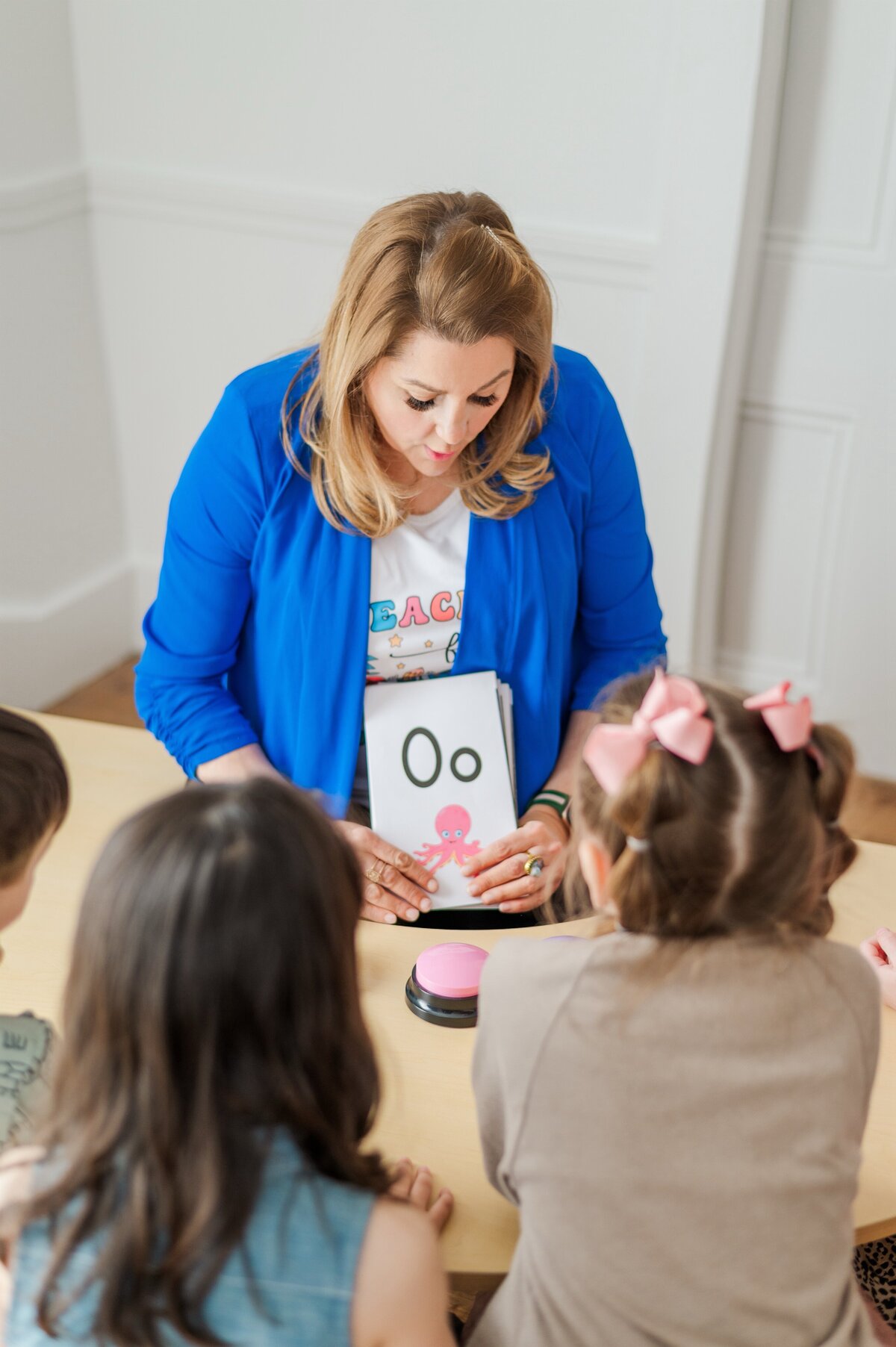 Mrs. Hansome teaching letters to students at House of Parker Preschool Gorham Maine
