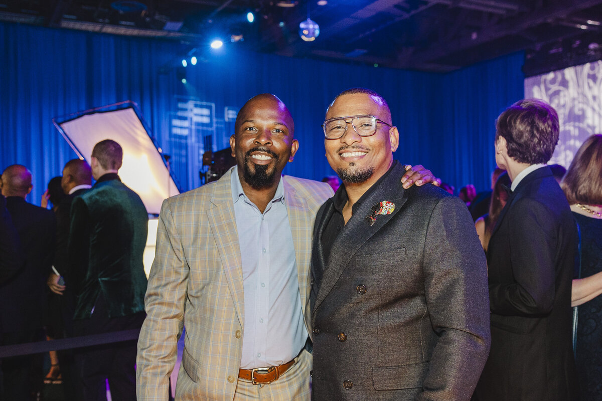 Two people smile at a DC event.