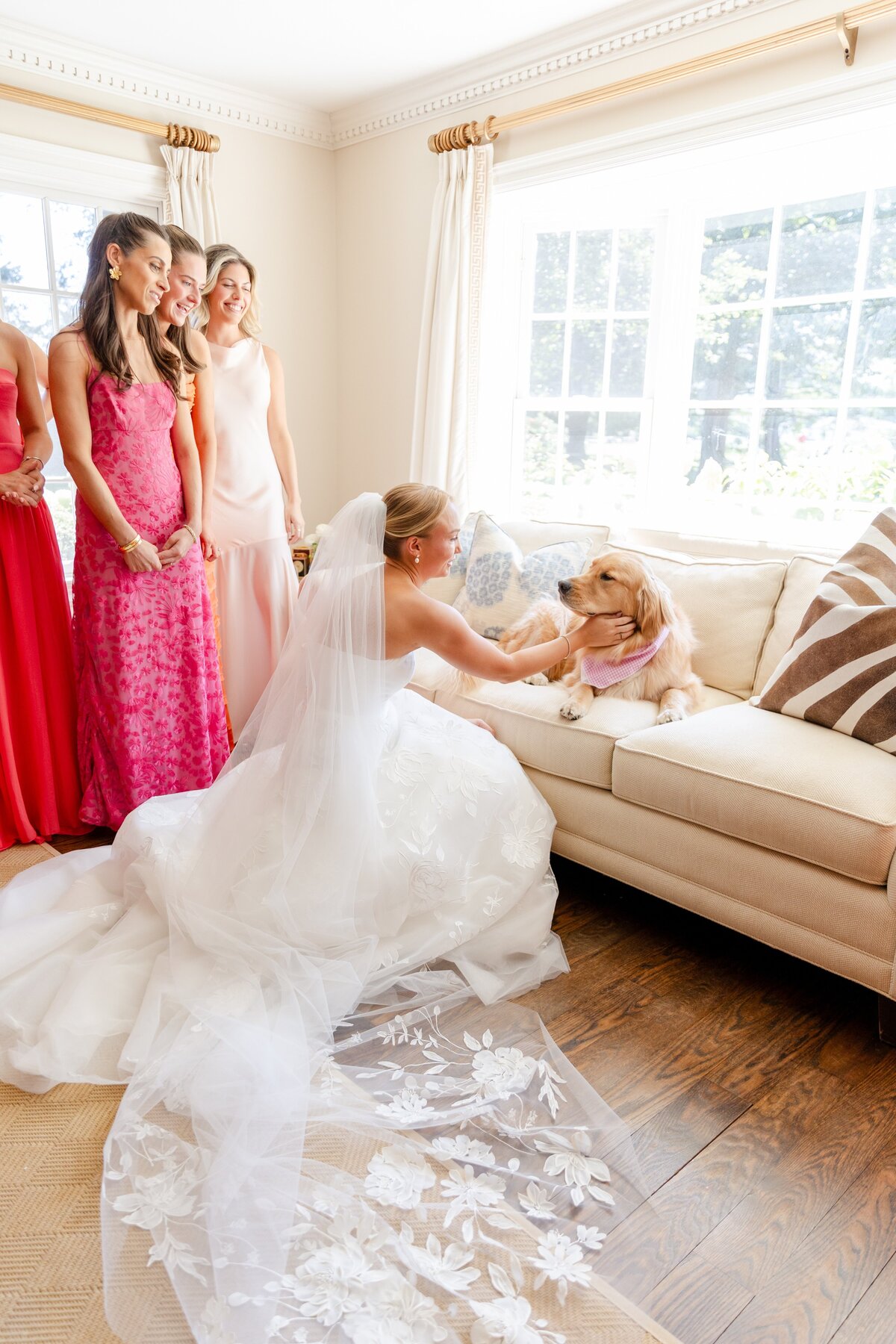bride first look with dog and bridesmaids