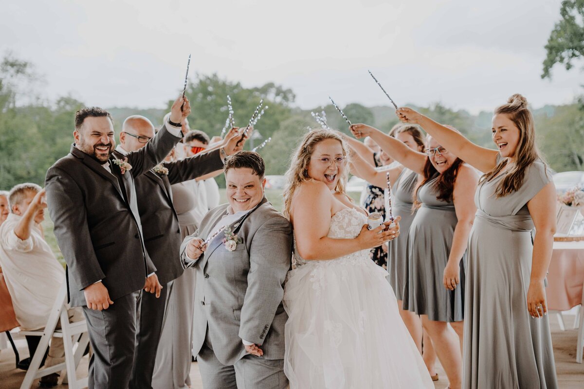 lgbt wedding introducing the couple with harry potter wands