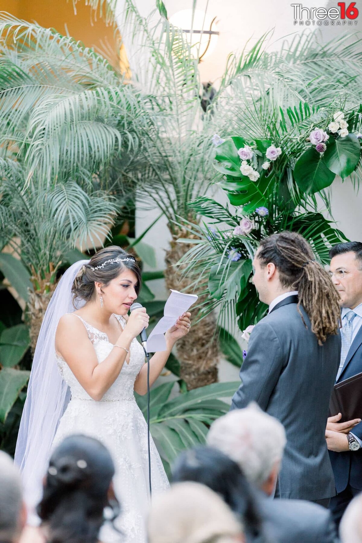 Bride reads her vows to her Groom into the microphone