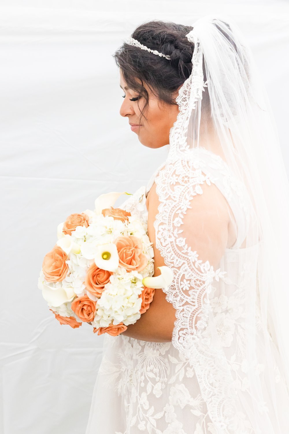 side view bride veil and bouquet