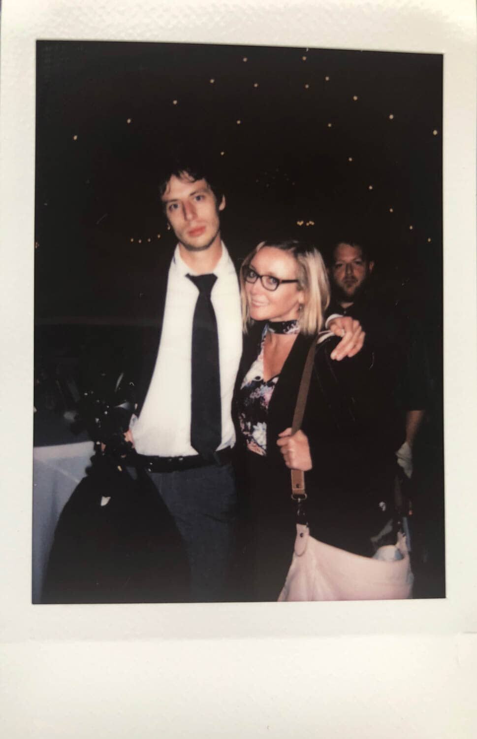 a polaroid of crystal genes photography and her boyfriend