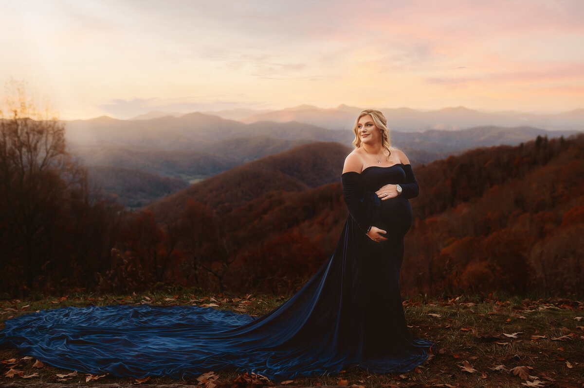 Pregnant woman poses for Maternity Photos on a mountaintop in Asheville, NC.
