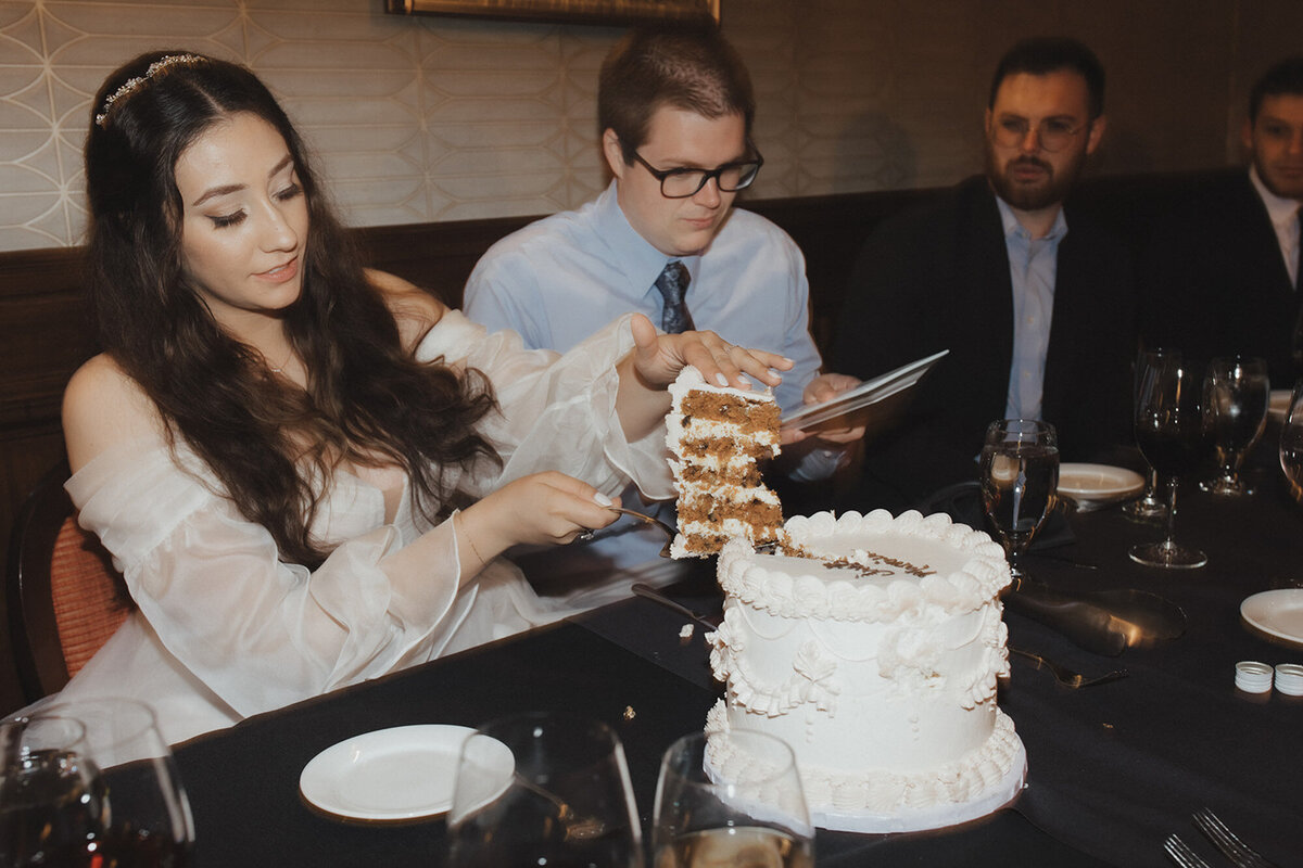 Cerise and Geoff's wedding day enjoying their cake