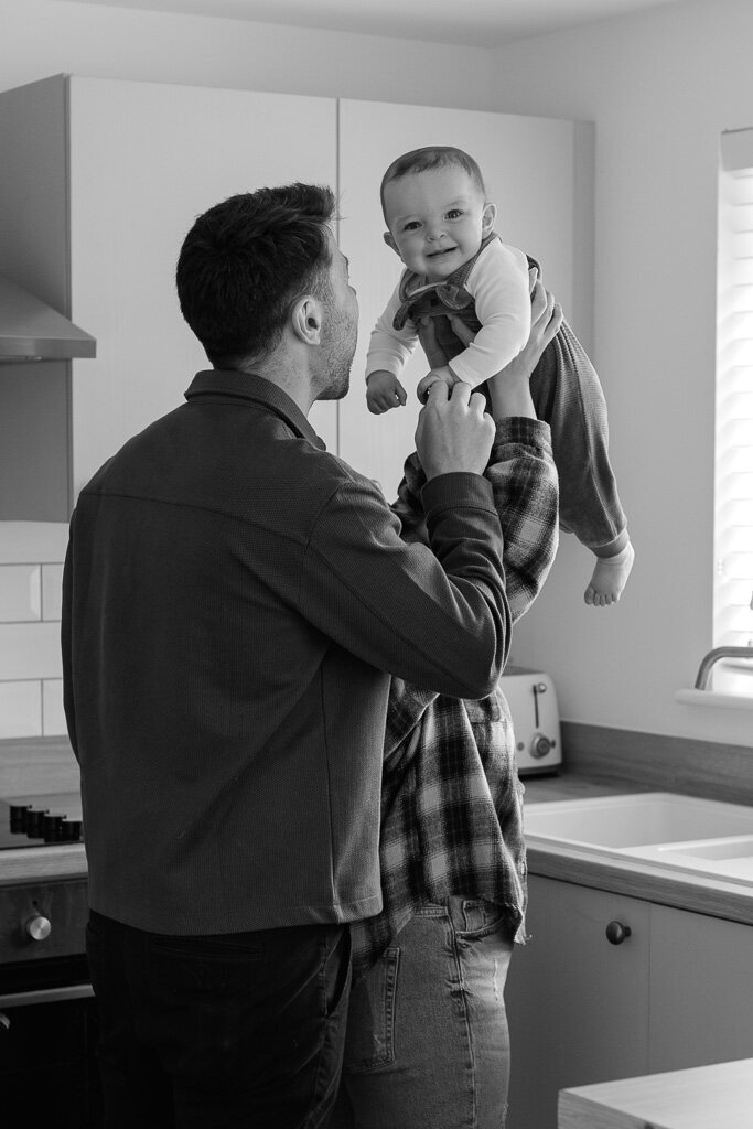 Candid family moment at home in Buxton captured by Nostalgia Photography