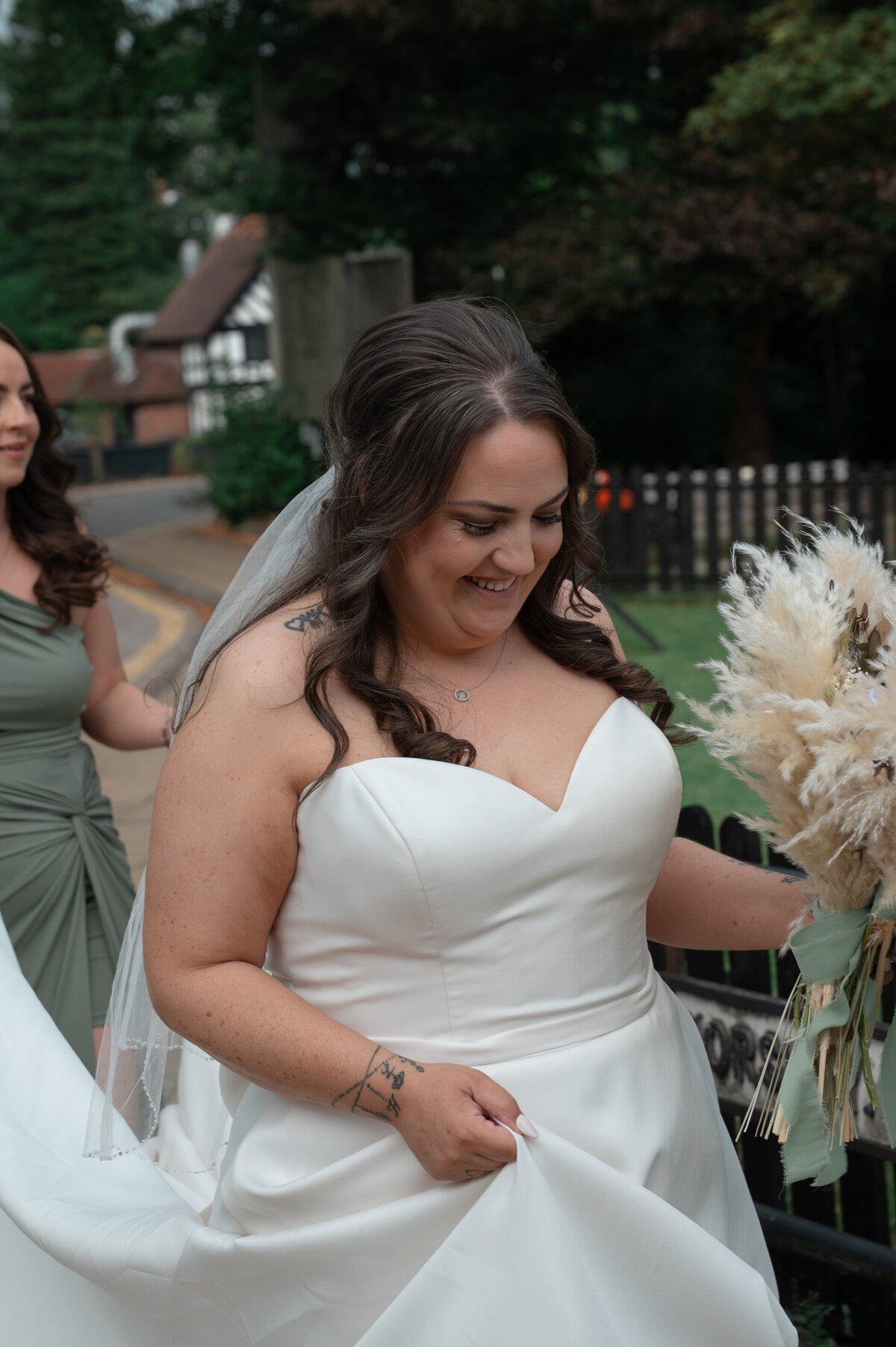 Bride walking into her venue at Worsley Court House - Manchester Wedding Photography 