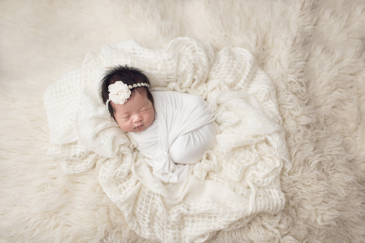 a all white themed newborn photography session