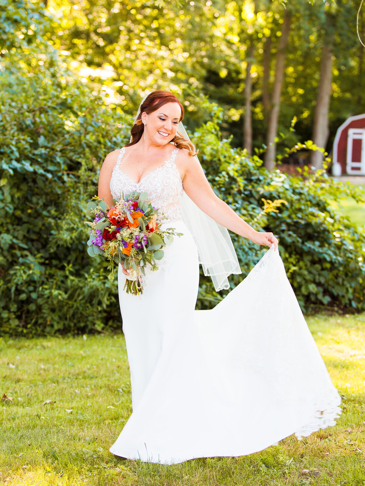 Bride twirls her gown during her backyard wedding.