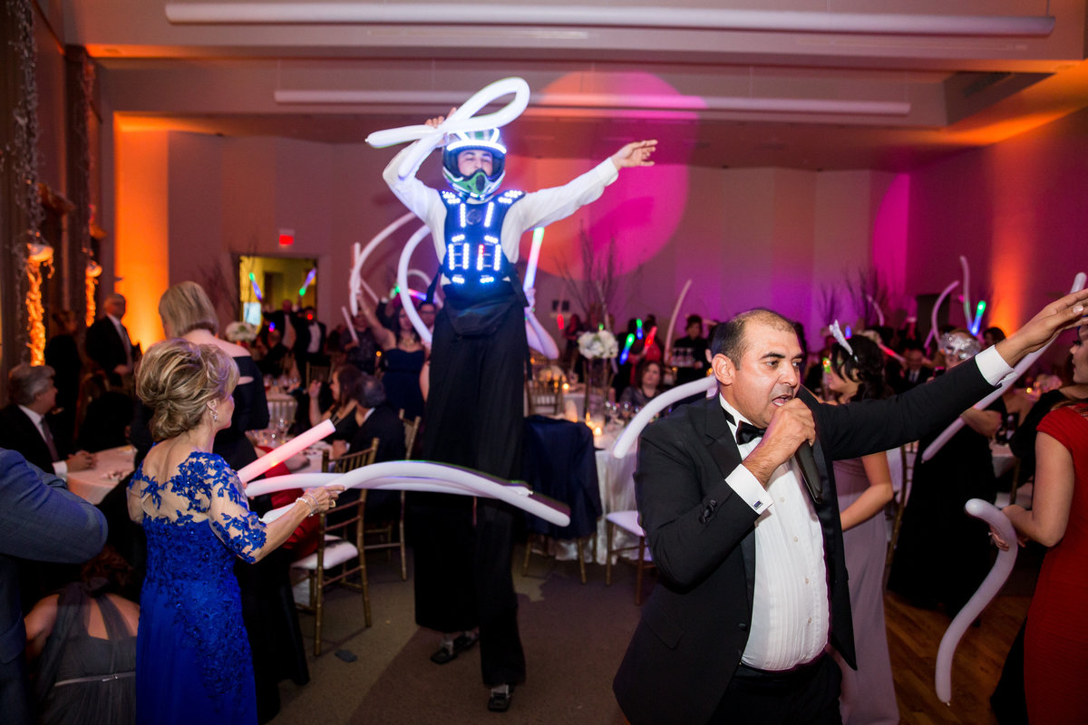 Stilt Walker robot dancing at reception with guests during wedding at The Witte Museum Venue in San Antonio