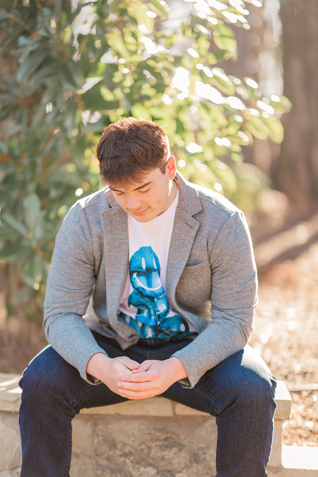 Jakob smiling during his at-home senior photo shoot