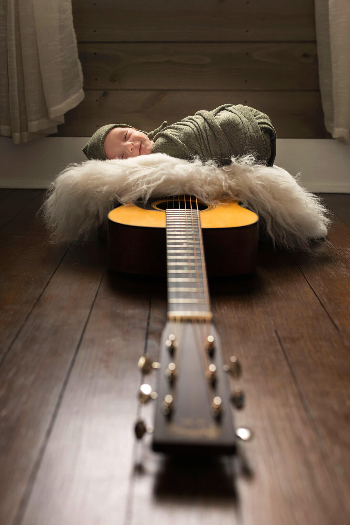 NJ Newborn photos of baby on guitar
