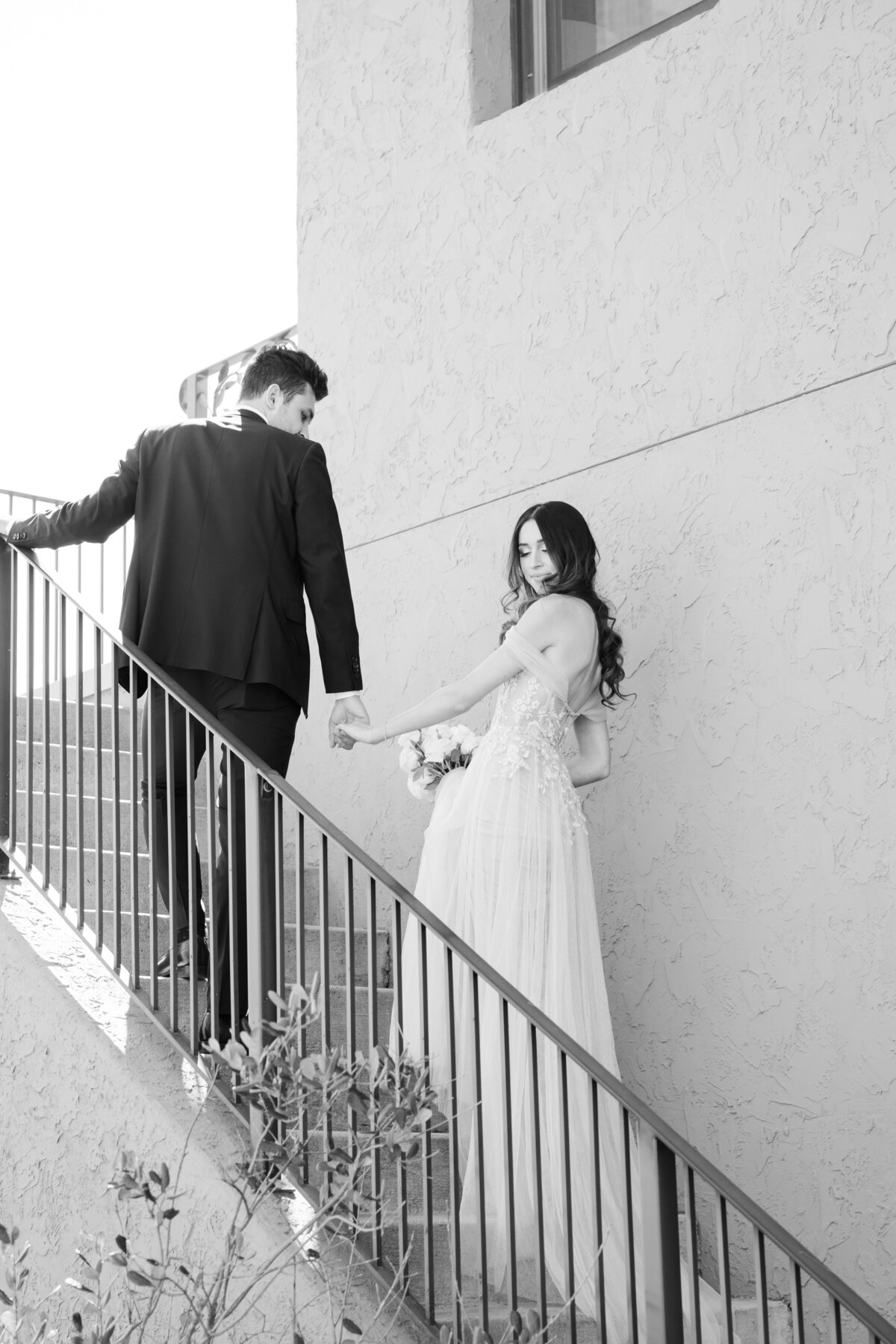 bride and groom stairs pose
