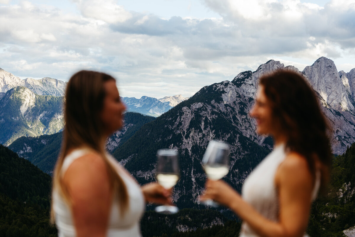 Lesbian couple exchanging vows Slovenia mountains