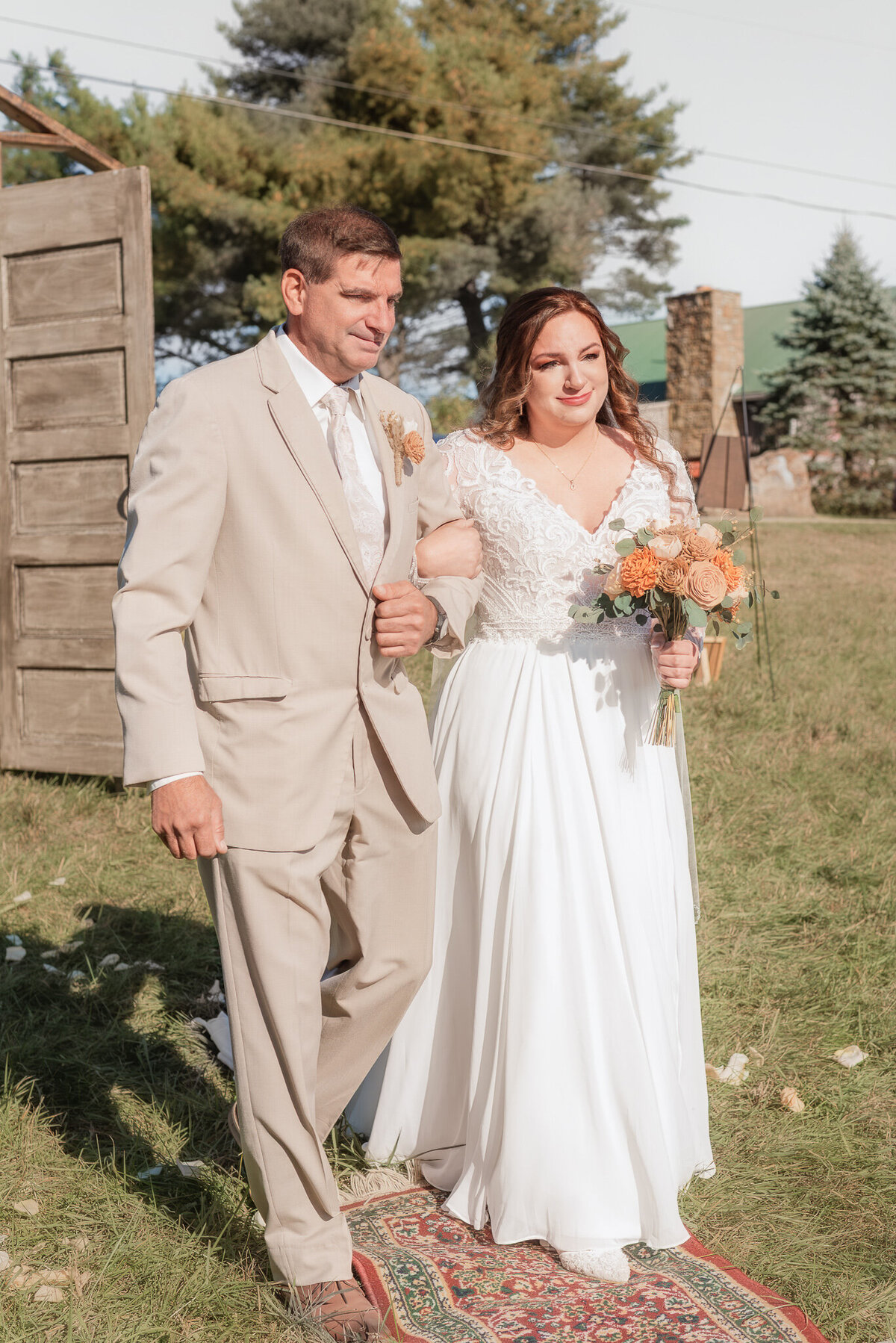 Bride and her father walking together during an intimate outdoor ceremony in southwestern Pennsylvania, captured  by Bree Stewart of LLP