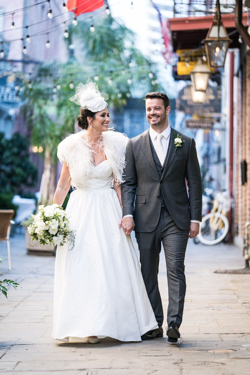 Bride and groom walking in Exchange Place