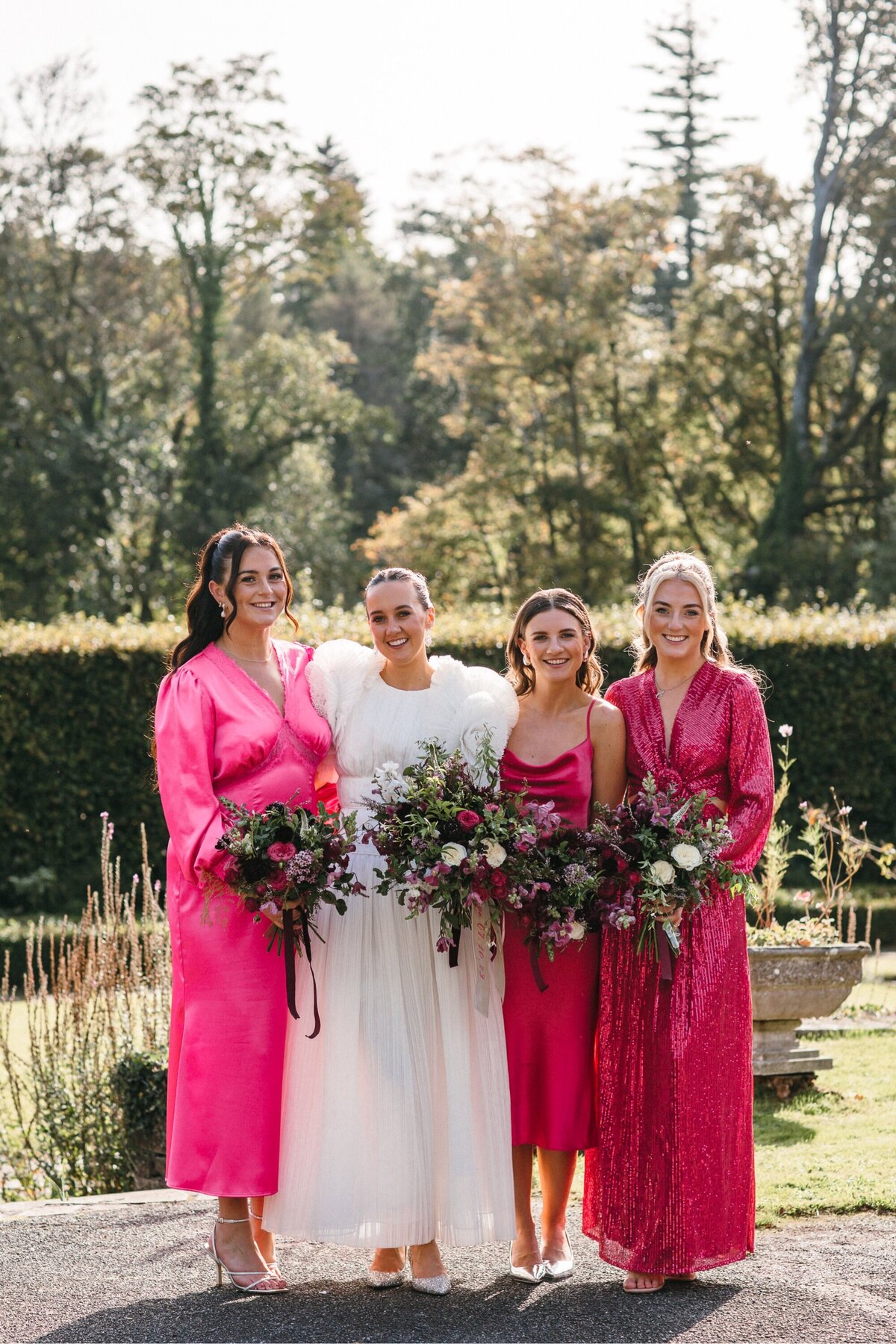 Bride and her Bridesmaids in hot pink dresses